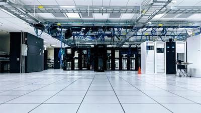 a large room with a bunch of wires hanging from the ceiling