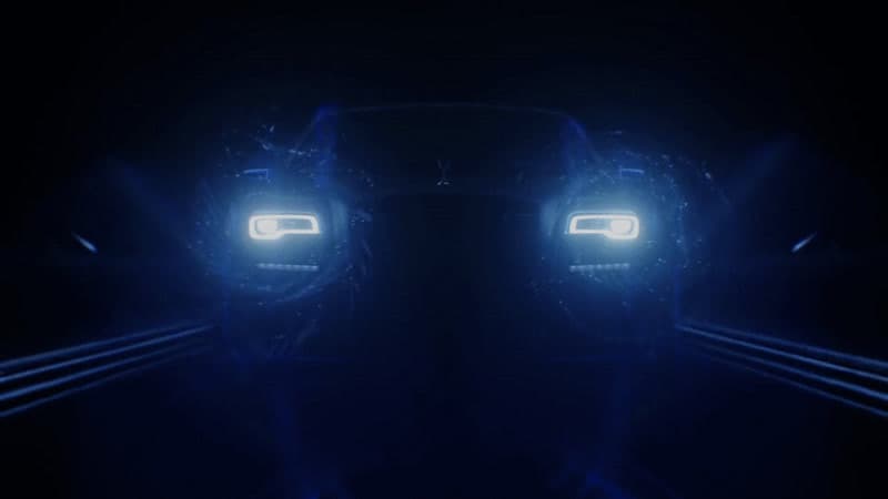 two headlights of a car in the dark