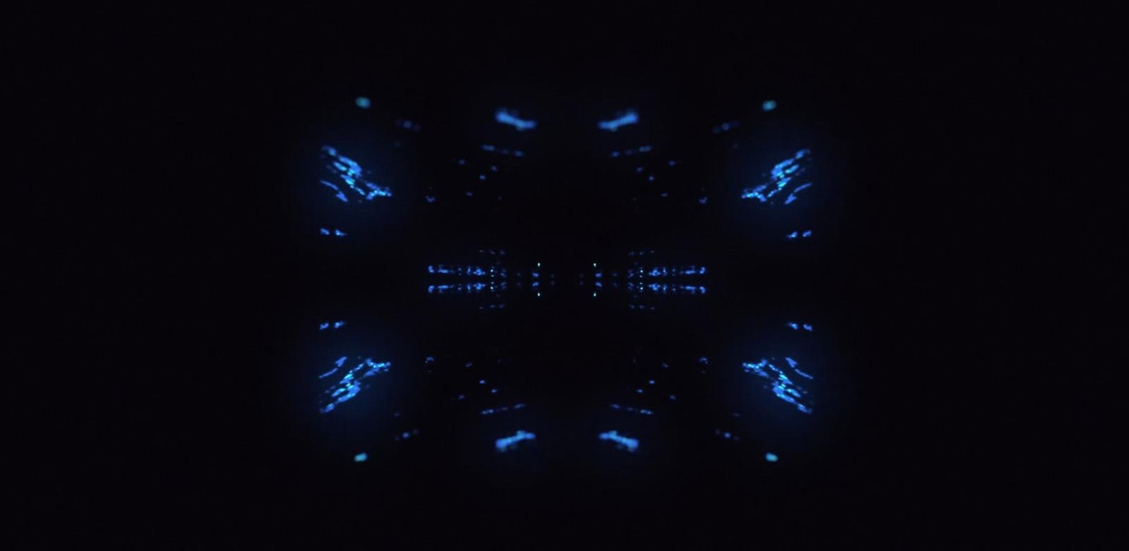 a black background with blue lights in the middle