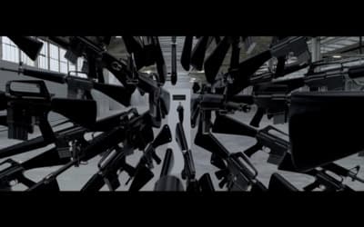 a bunch of guns that are in a room