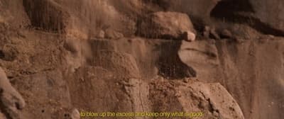 a close up of a rock formation with a quote on it