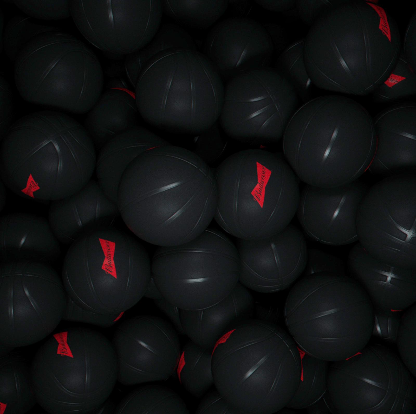 a pile of black balls with red arrows on them