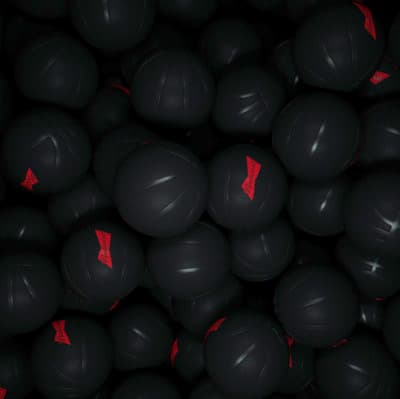 a pile of black balls with red arrows on them