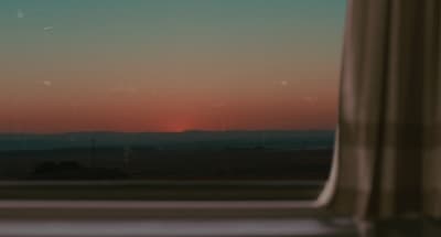 a window with a view of a sunset