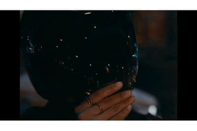 a close up of a person wearing a black helmet