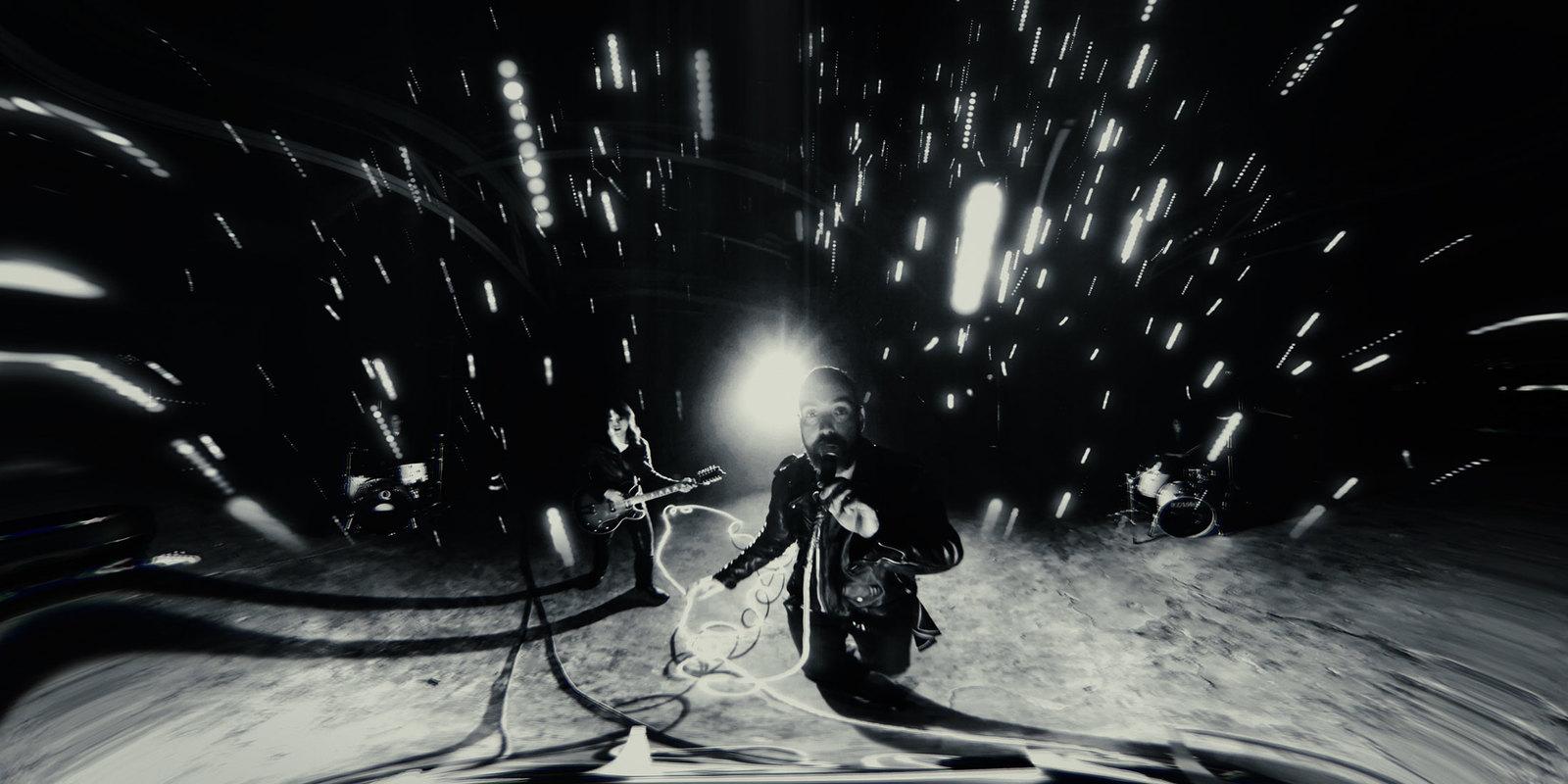 a black and white photo of a man with a snowboard