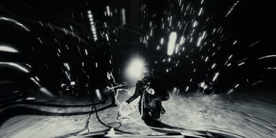 a black and white photo of a man with a snowboard