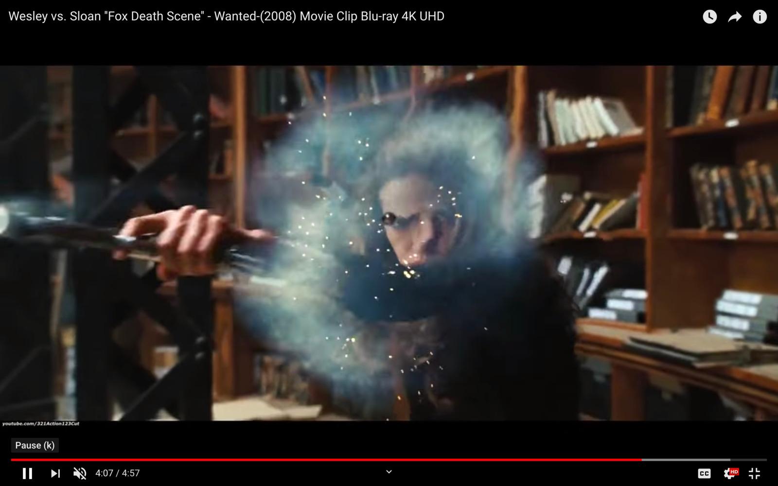 a person holding a wand in a room