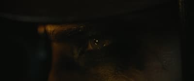a close up of a person's face in the dark