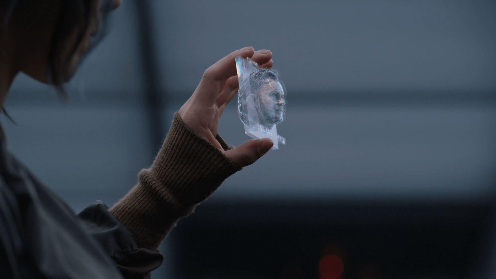 a person holding a plastic object in their hand