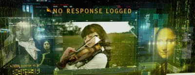 a woman holding a violin in front of a screen