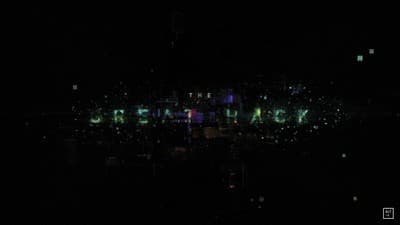 a city at night lit up with neon lights