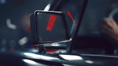 a close up of a mirror on a car