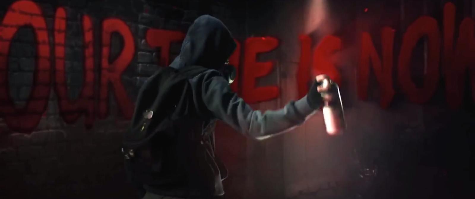 a person in a hooded jacket holding a flashlight