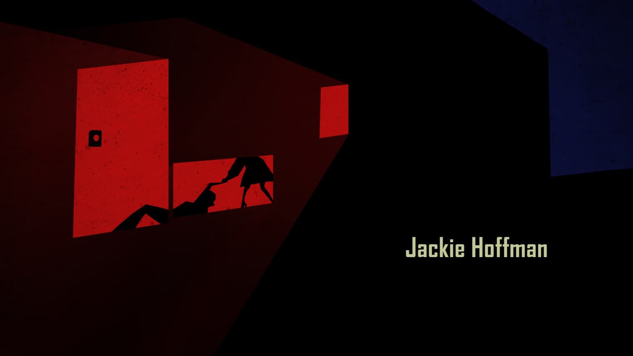 a person climbing up a wall with a red light