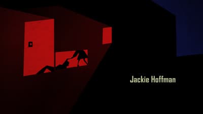 a person climbing up a wall with a red light