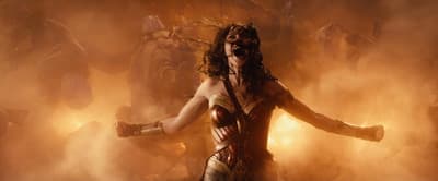 a woman in a costume standing in front of a crowd of people