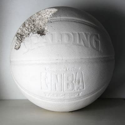 a close up of a white ball on a table