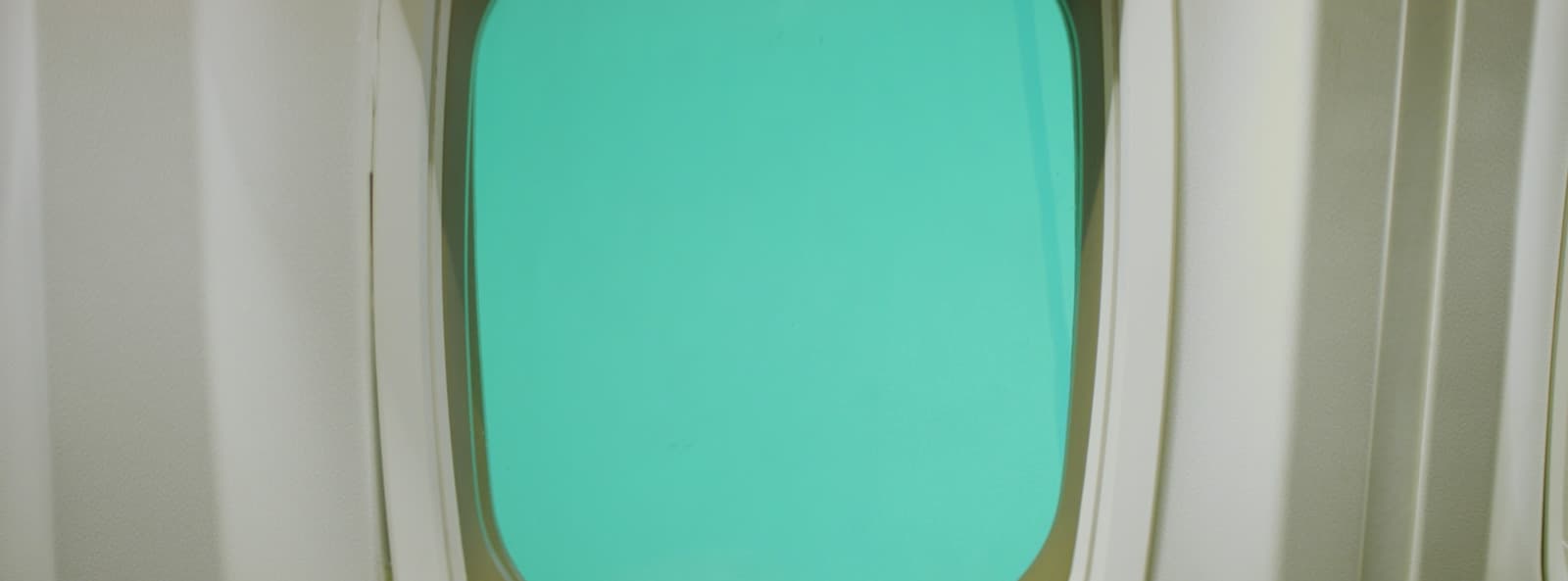 a surfboard in a room with white walls