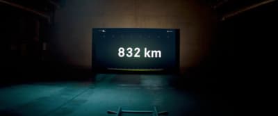 a sign that reads 822 km in a dark room