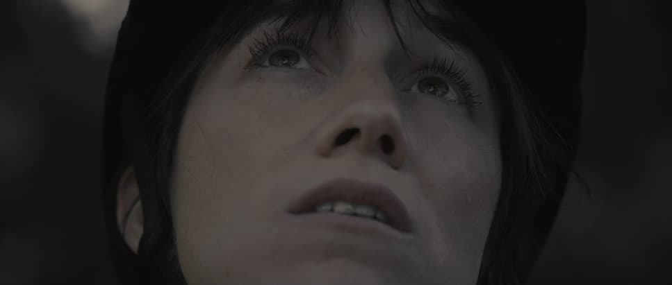 a close up of a person wearing a hat