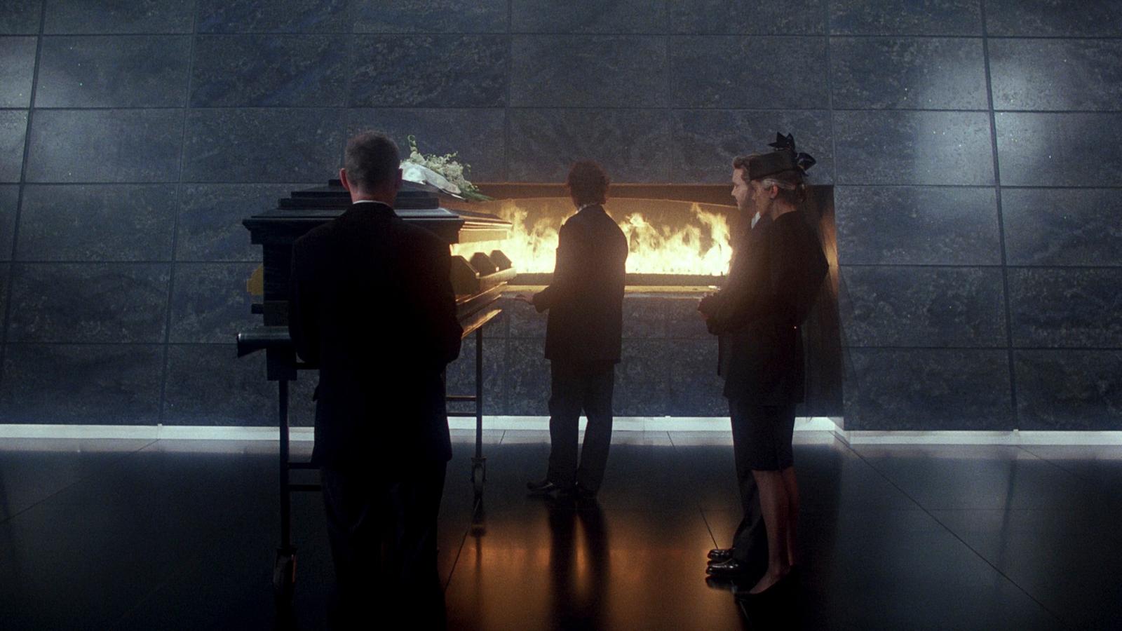 a group of people standing in front of a fire