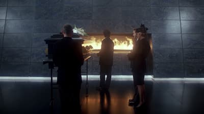 a group of people standing in front of a fire