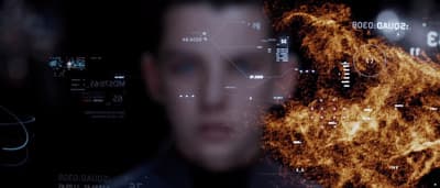 a man in a suit is looking at a computer screen