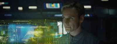 a man standing in front of a computer screen