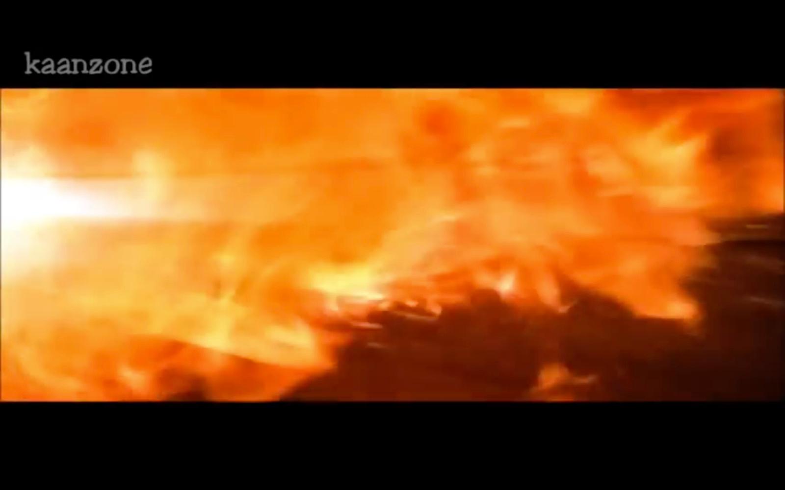 a blurry photo of a fire with the words kazoone on it