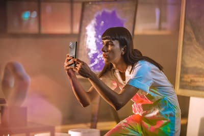 a woman taking a picture with her cell phone