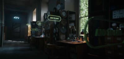 a dimly lit room with clocks on the wall