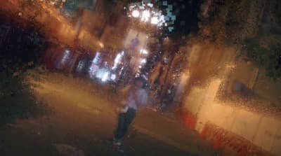 a blurry photo of a person walking down a street
