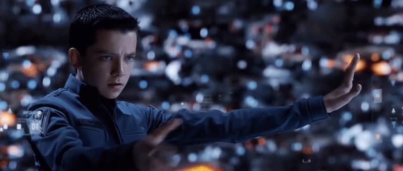 a man in a blue jacket holding out his hands