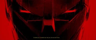 a red poster with a batman mask on it