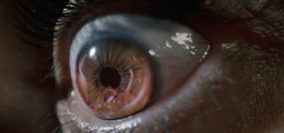 a close up of a person's brown eye