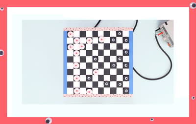 a black and white checkered board with a red border