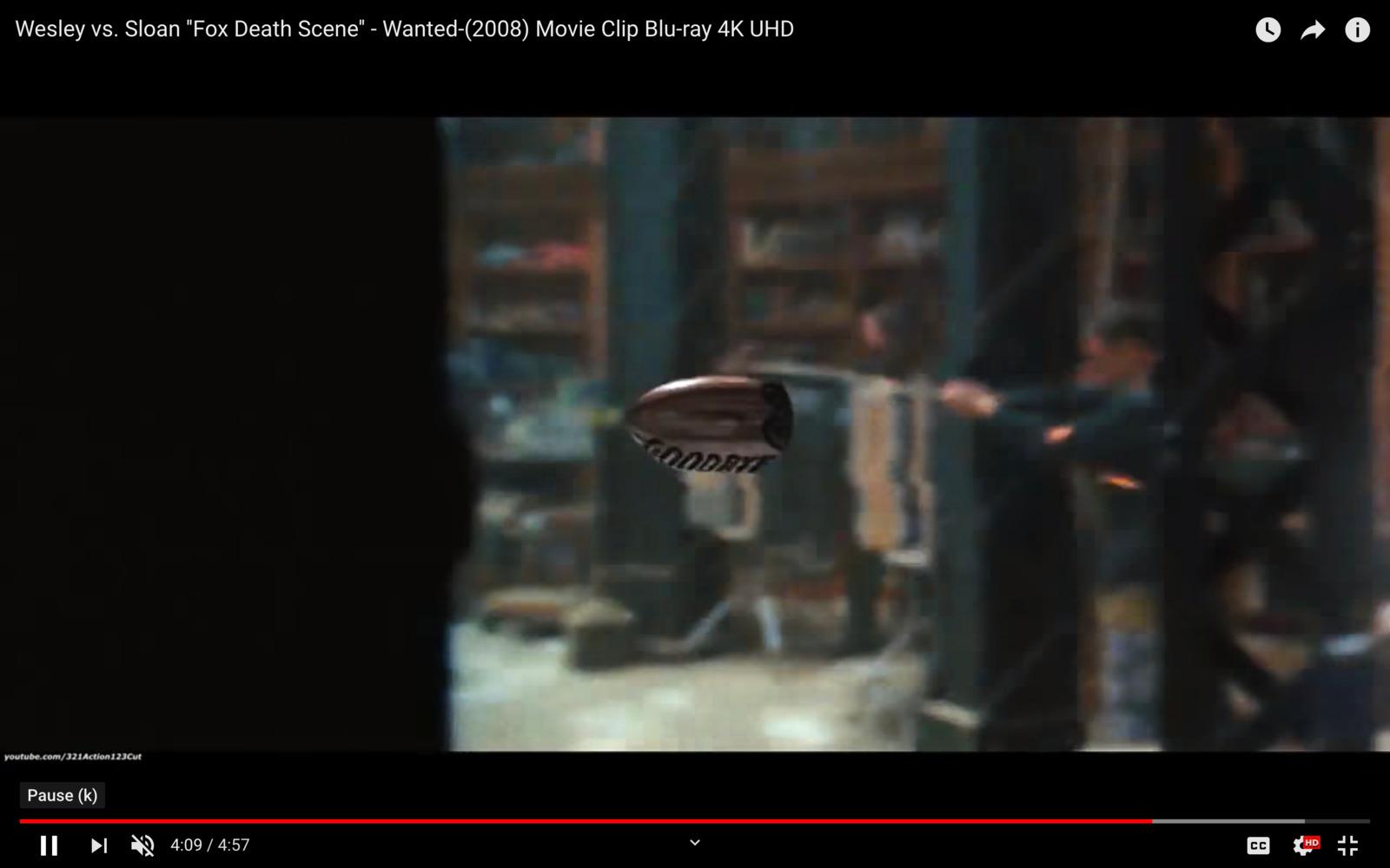 a video player is playing a video of a man in a suit