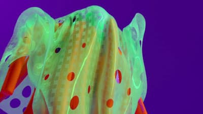 a close up of a colorful object with a purple background