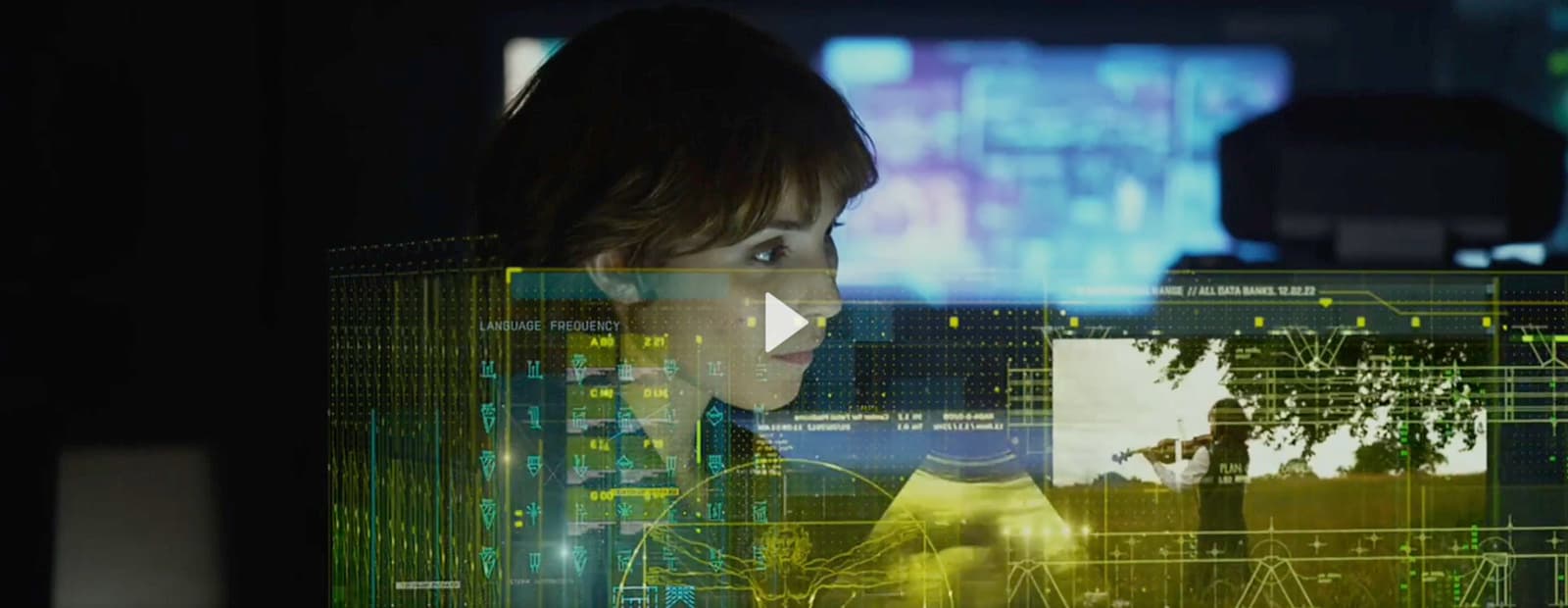 a woman looking at a computer screen with a tree in the background