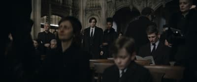 a group of people standing around each other