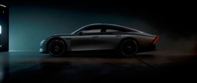 a car is shown in front of a dark background