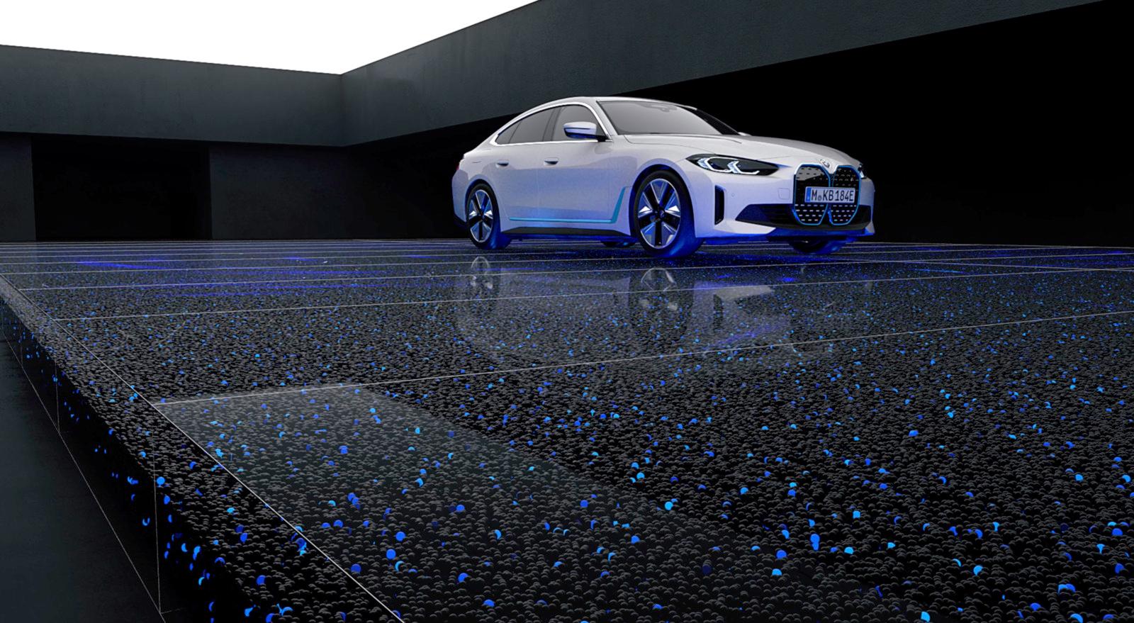 a white car parked in a dark room