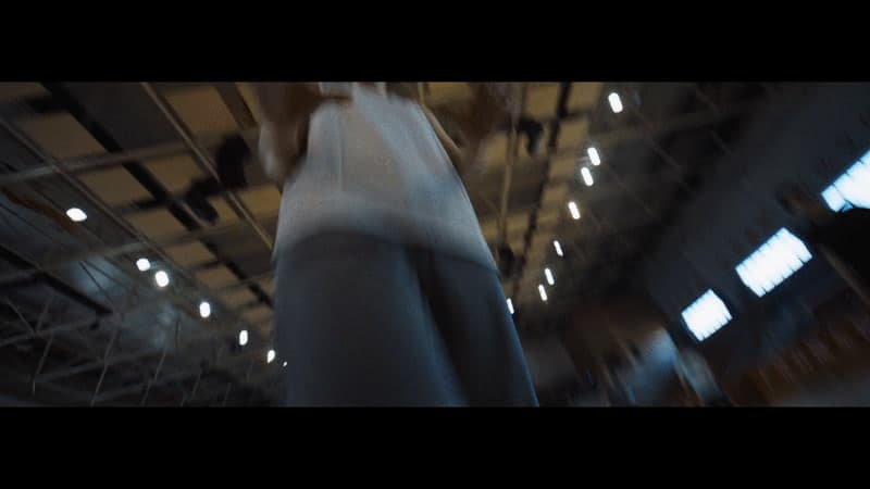 a blurry photo of a person standing in a building