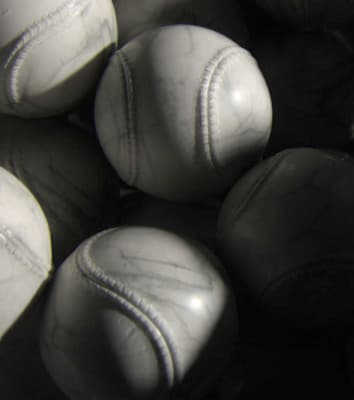 a close up of a bunch of white balls