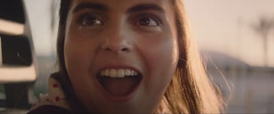 a close up of a person with a surprised look on their face