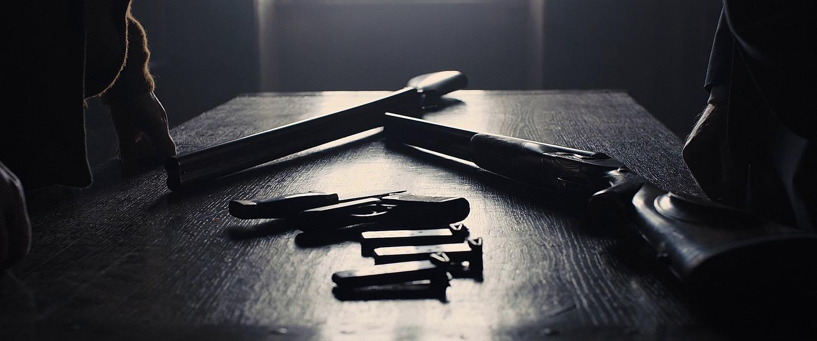 a pair of scissors sitting on top of a wooden table