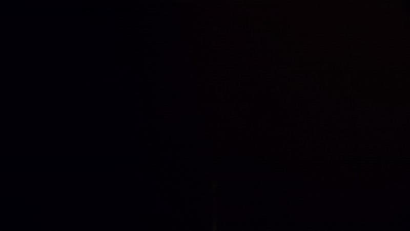 a clock tower lit up in the dark