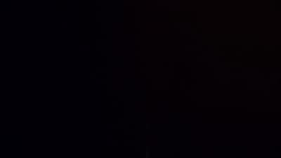 a clock tower lit up in the dark