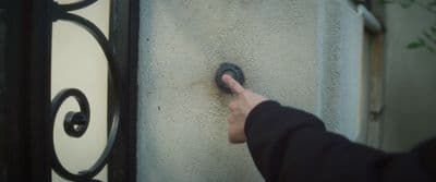 a person pointing at something on a wall